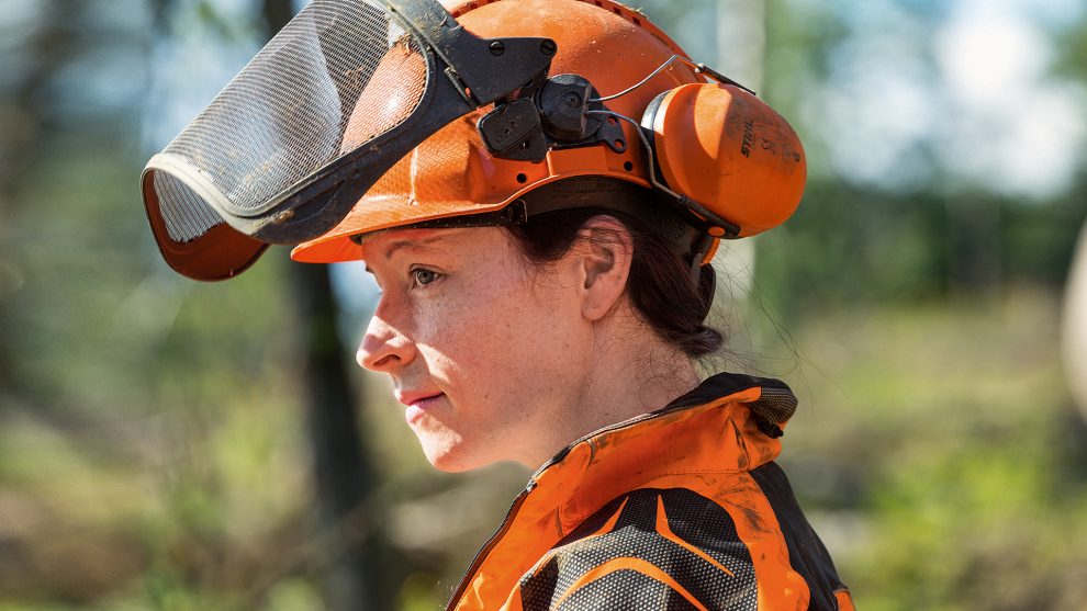 Worker wearing STIHL visor and safety glasses