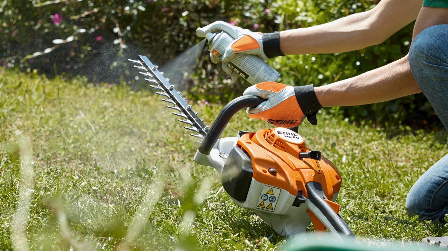 Cleaning resin and sap off a STIHL hedge trimmer cutting blade