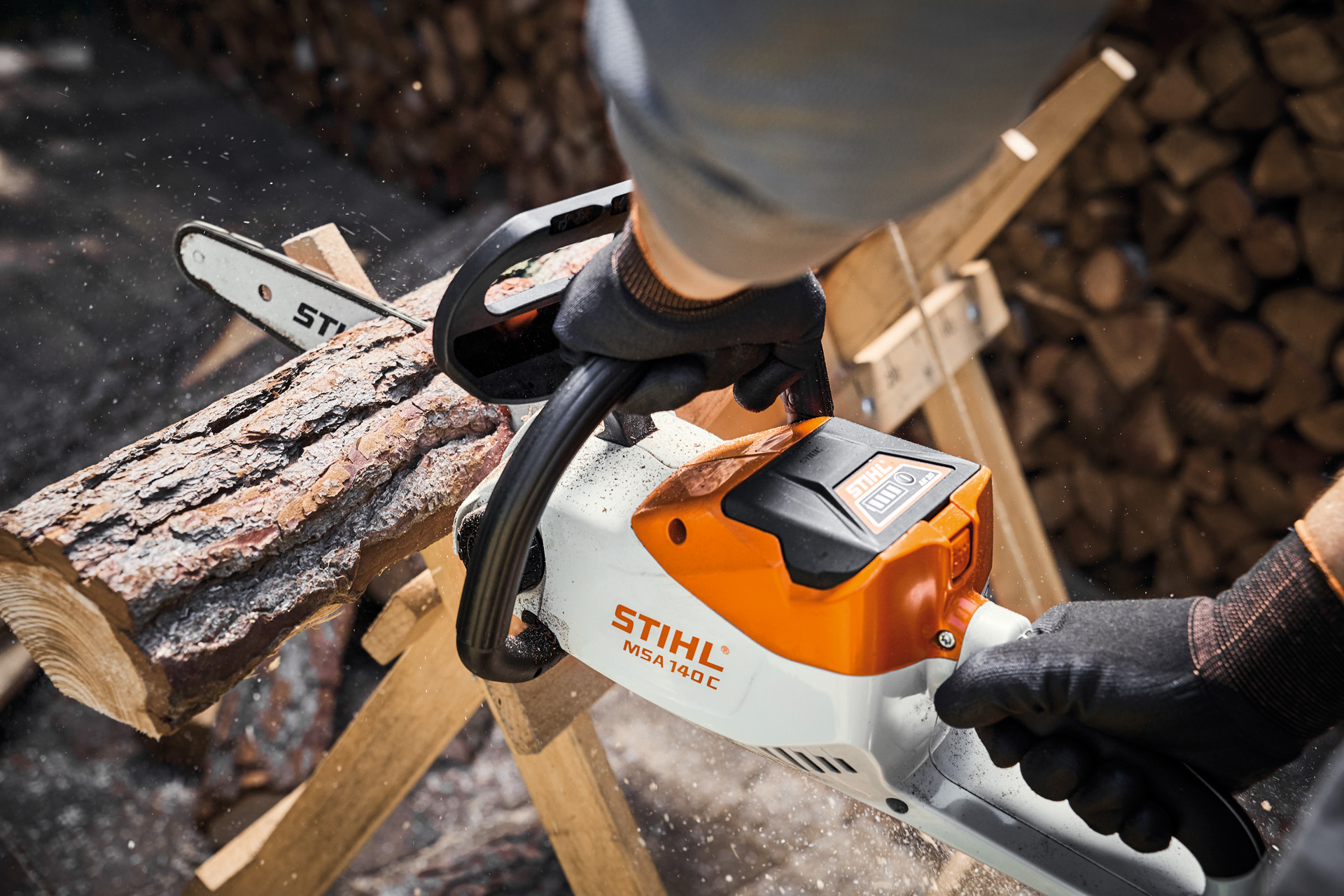 Tree trunk is sawn up with a STIHL chain saw