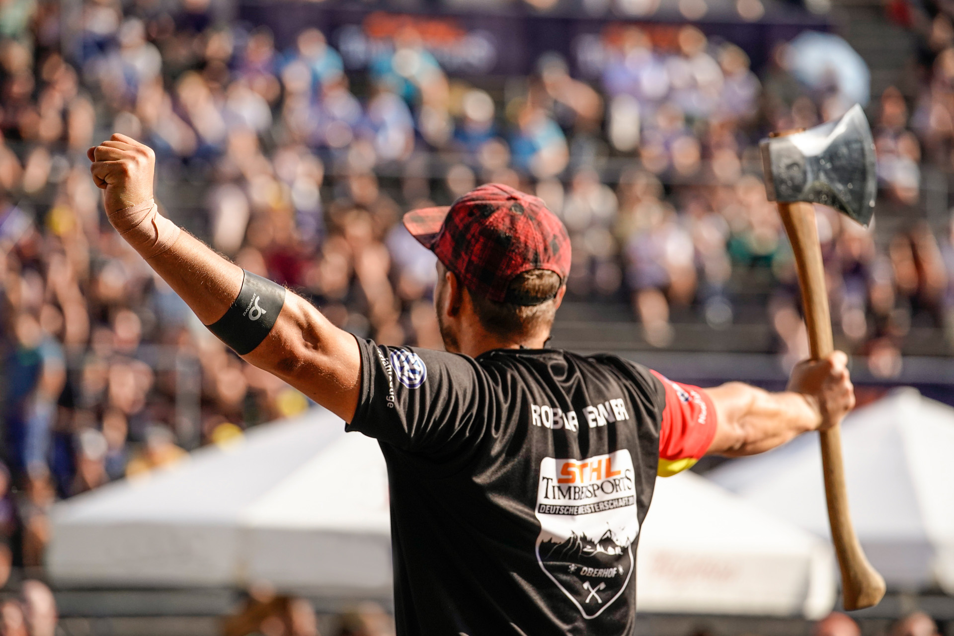 A man celebrates at a Timbersports event