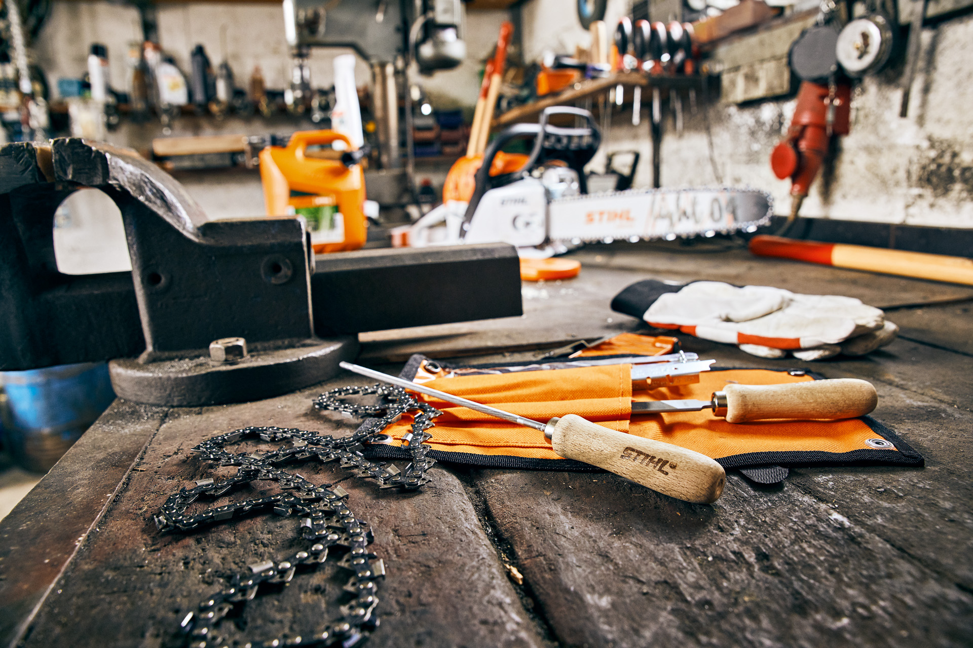 Workbench with sharpening tools and saw chain