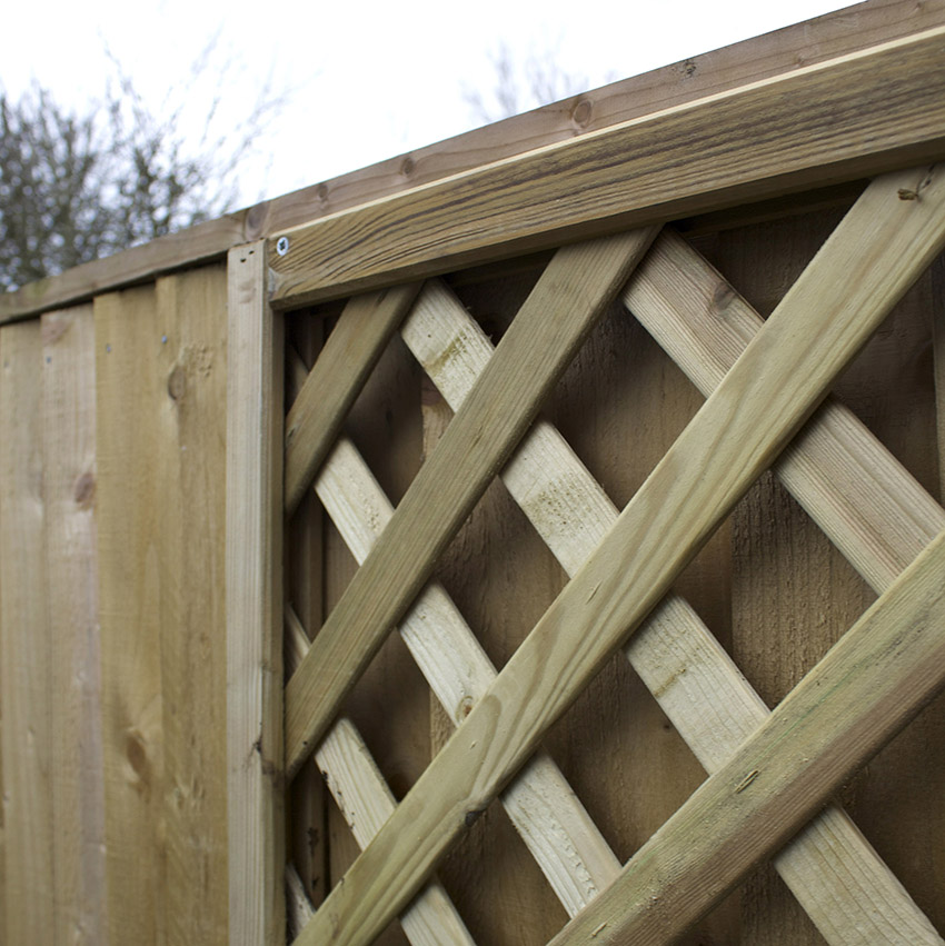 Wooden trellis attached to garden fence